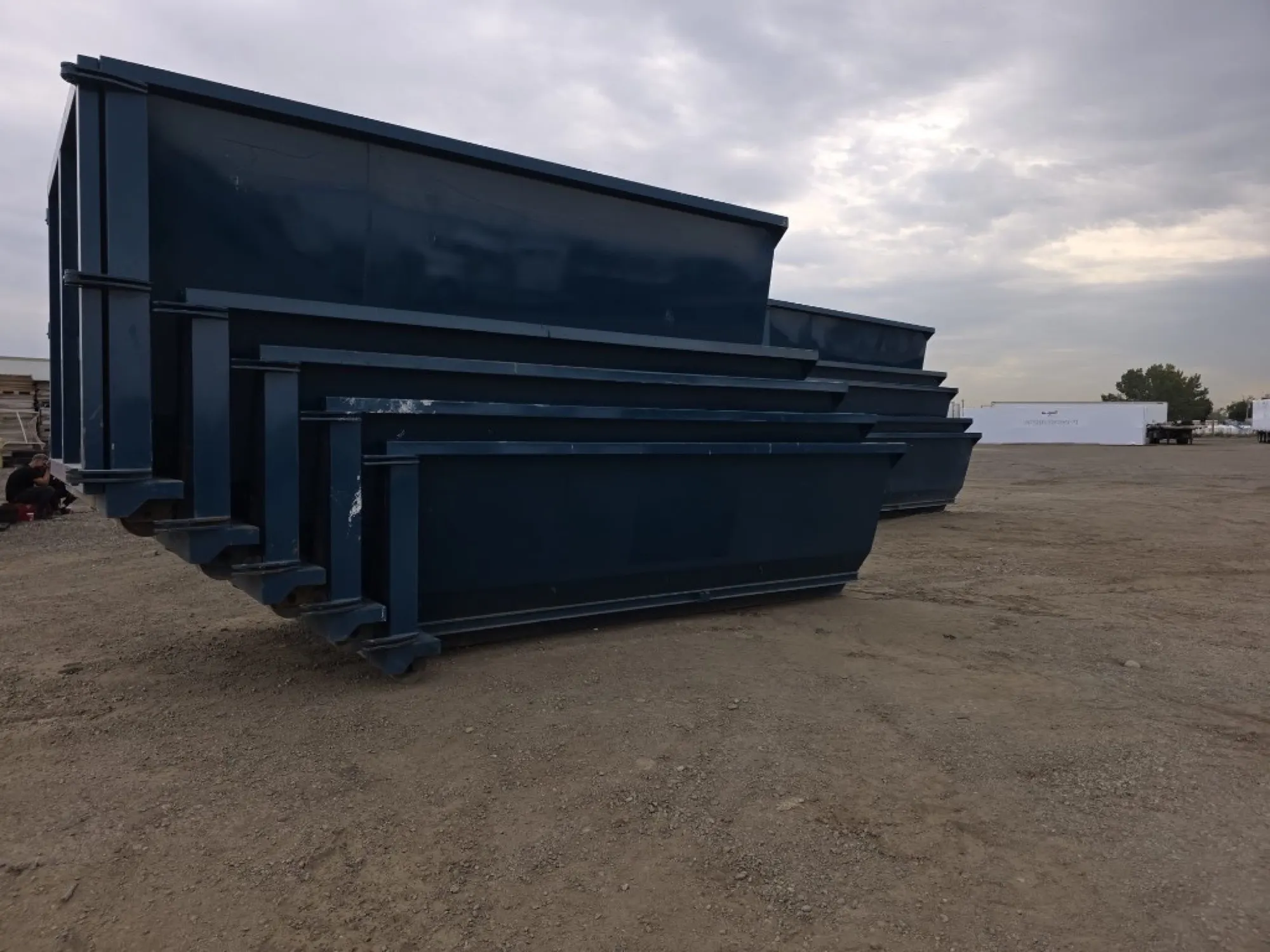 Nested 12, 15 and 20 yard YEG Boss Bins on the yard